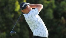 Gary Woodland strikes a tee shot with a driver