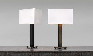Table Lamp features a polished black metal base and white silk lampshade