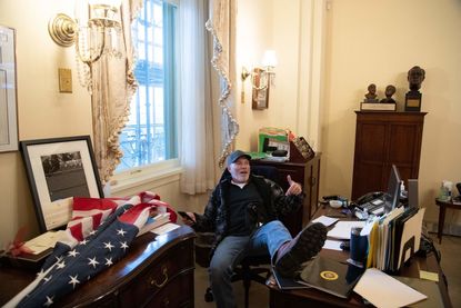 Richard Barnett inside Nancy Pelosi&amp;#039;s office.