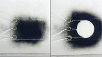 two images; the one on the left shows a small rectangle of glass covered in black dust; the one on the right shows a clear circle with no dust on the same glass rectangle