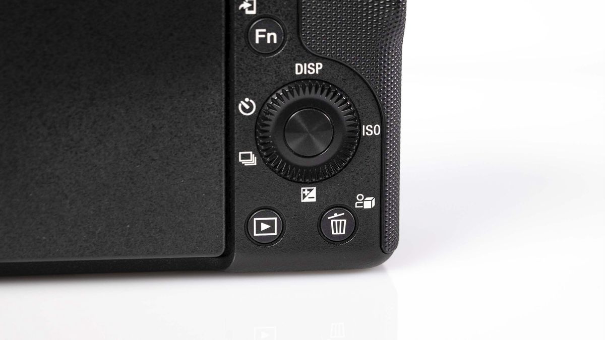 Sony ZV-E10 II on reflective surface and white background