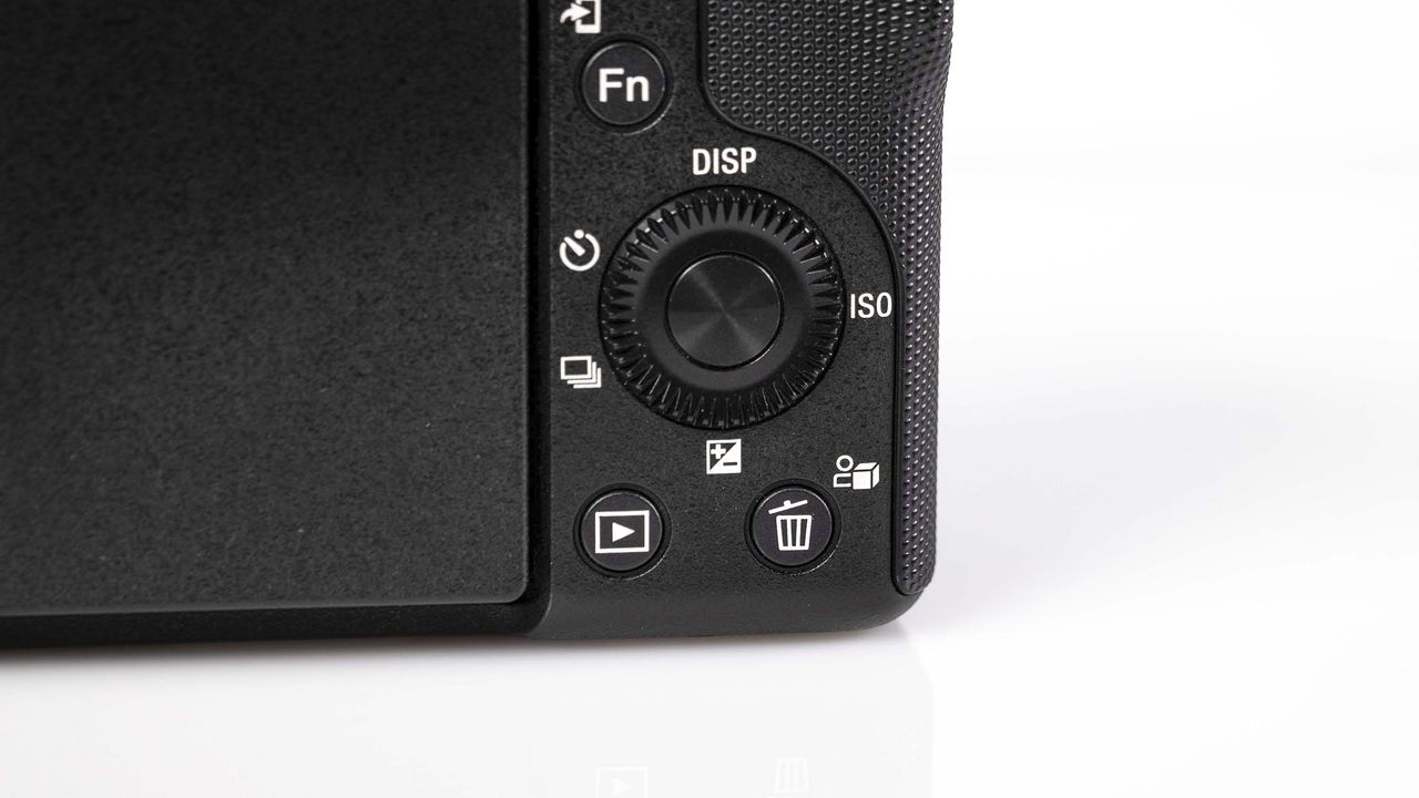 Sony ZV-E10 II on reflective surface and white background