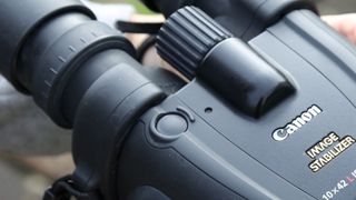 Image is a closeup of the Canon 10x42L IS WP binoculars.