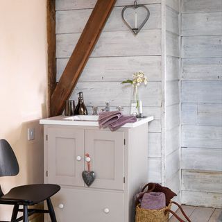 washstand with hanging heart and chair