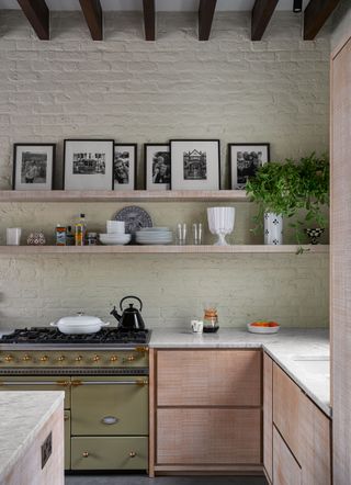 a modern stylish kitchen with a green range