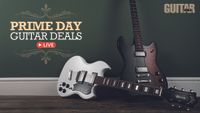 Guild guitars against a green wall 