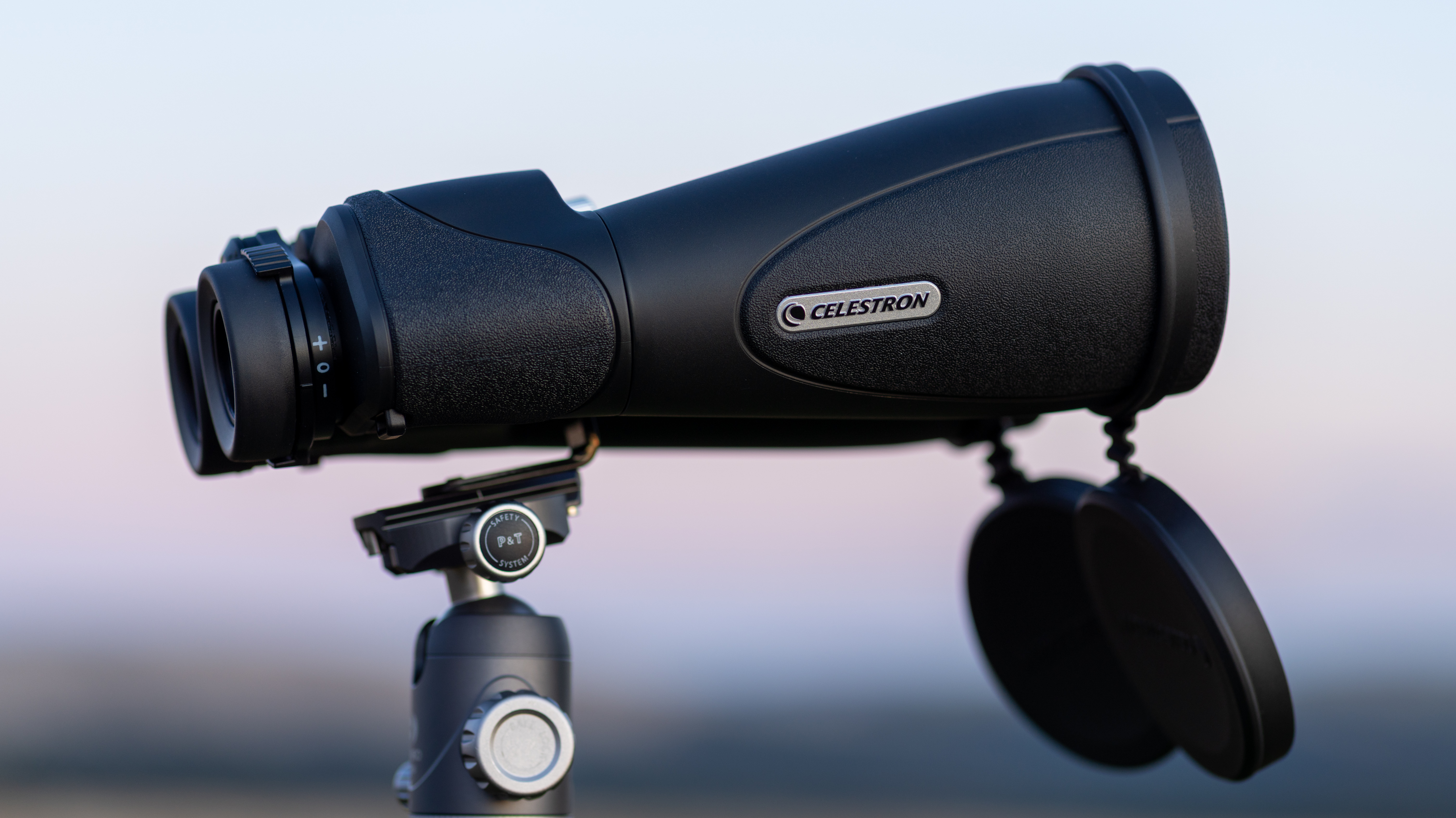 Celestron SkyMaster Pro ED 15x70 binoculars on a tripod at sunset