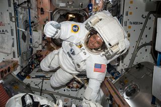 NASA astronaut Jack Fischer gives a thumbs-up sign while wearing an extravehicular mobility unit (EMU) spacesuit ahead of a May 12, 2017 spacewalk at the International Space Station. Fischer and NASA astronaut Peggy Whitson will conduct a repair spacewalk on Tuesday, May 23.