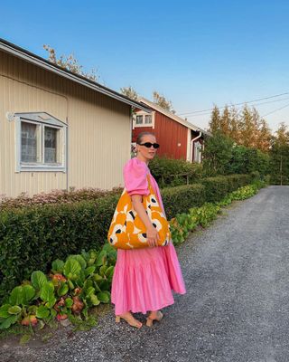 Pink sundress with floral bag