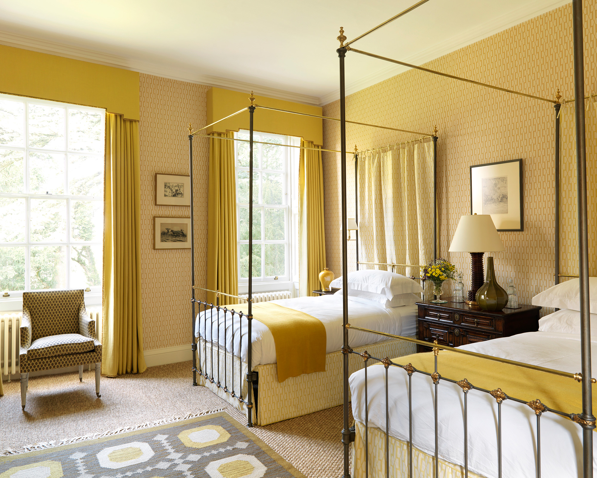Yellow bedroom with twin beds dressed in yellow, one of the major color trends 2021