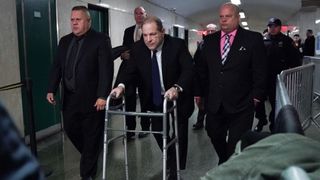 Harvey Weinstein using a walking aid