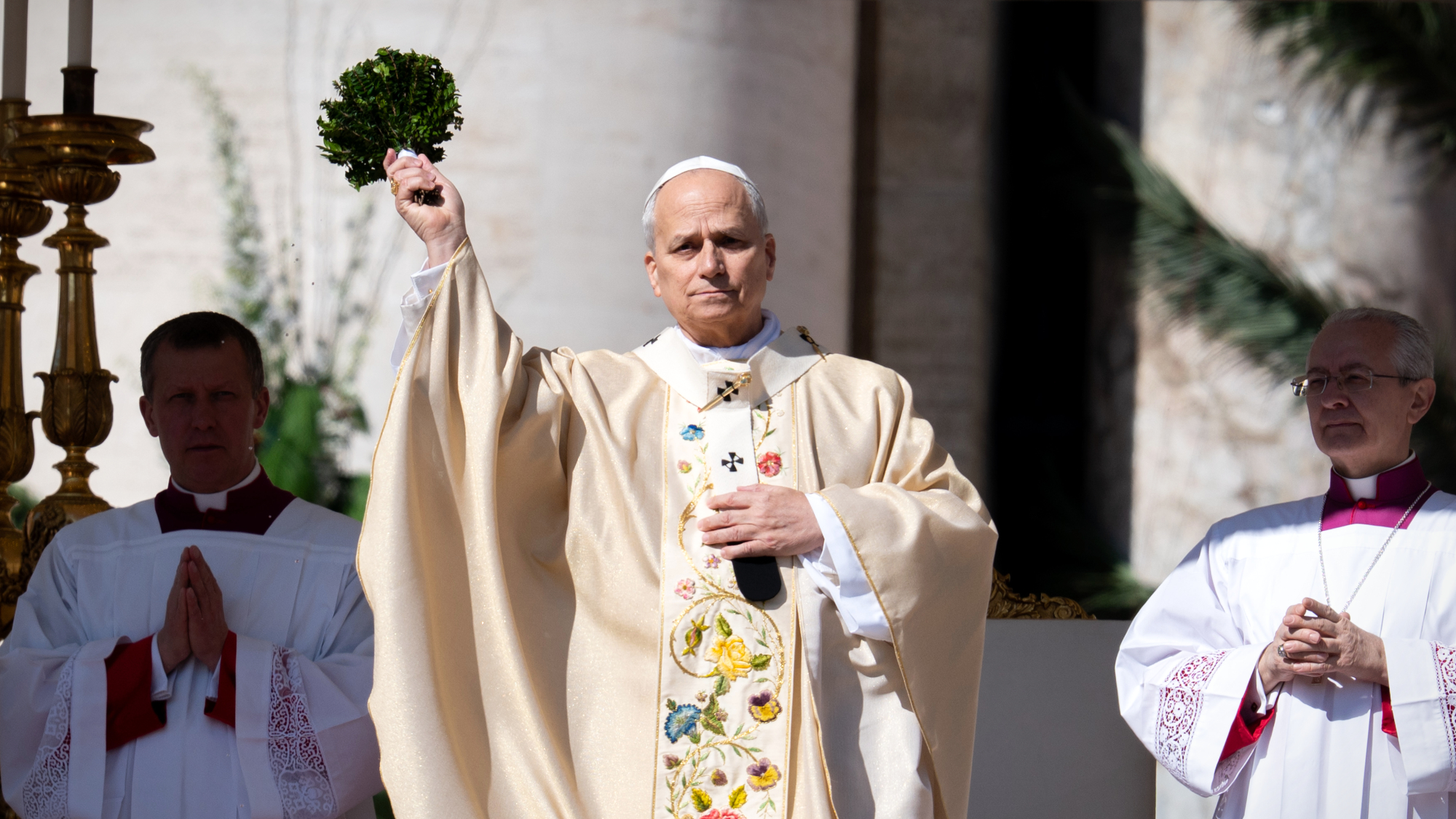 Pope Leo XIV sprinkles holy water during Easter Sunday Mass at the Vatican