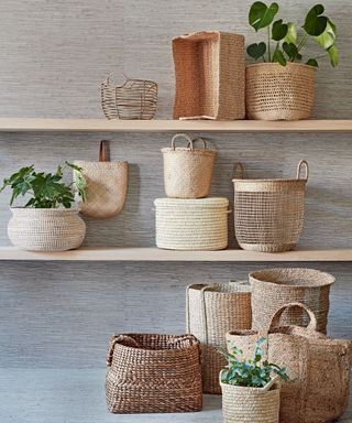 woven storage baskets on shelves with houseplants