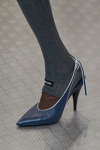 S/S 25 navy Miu Miu shoes.