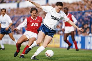 Chris Waddle in action for Tottenham against Arsenal and Kenny Sansom in 1987.