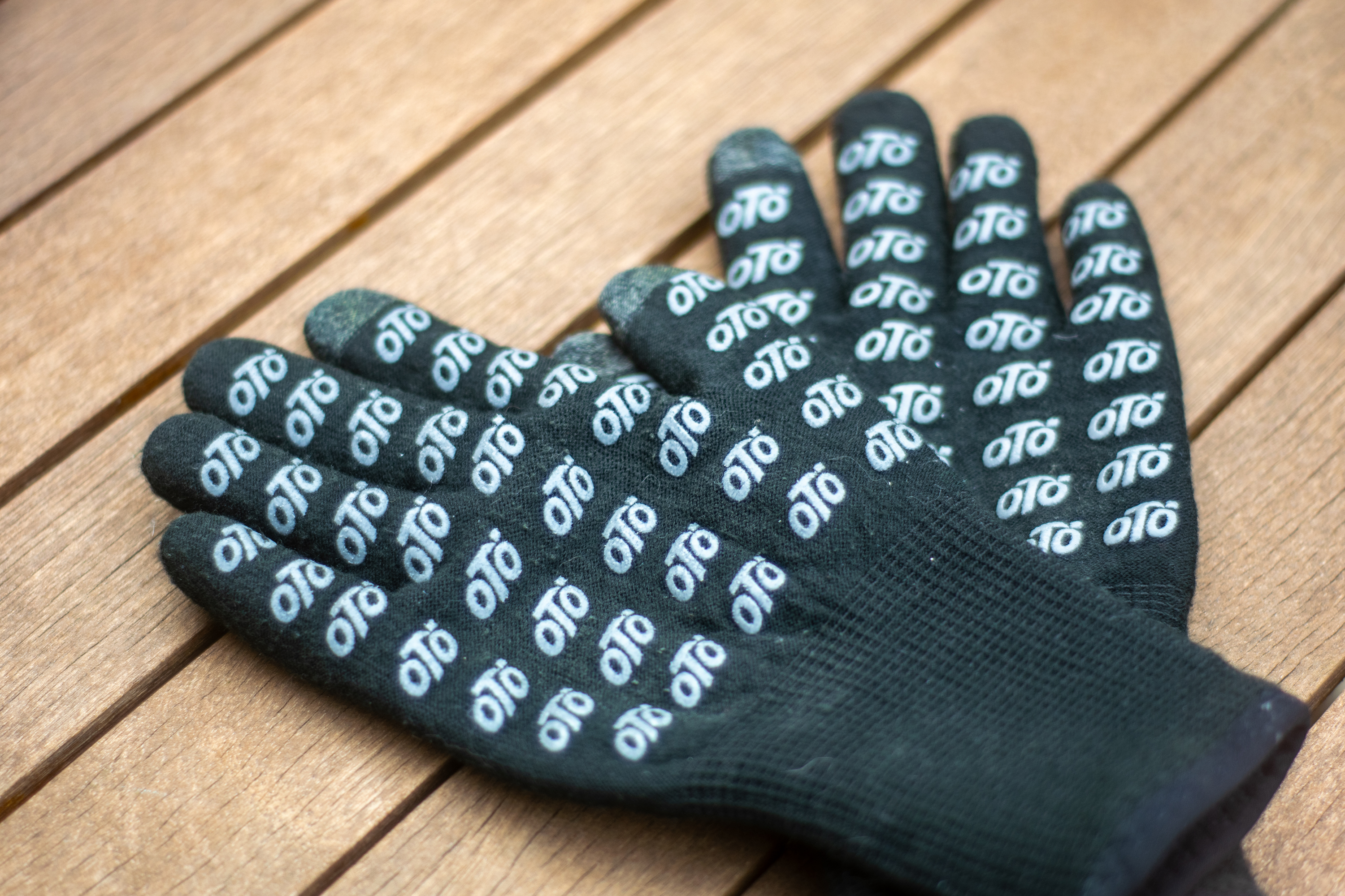 A pair of black VeloToze knitted waterproof gloves