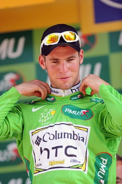 Mark Cavendish dons the green jersey for leading the points competition.