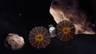 a spacecraft flying past a pair of Trojan asteroids