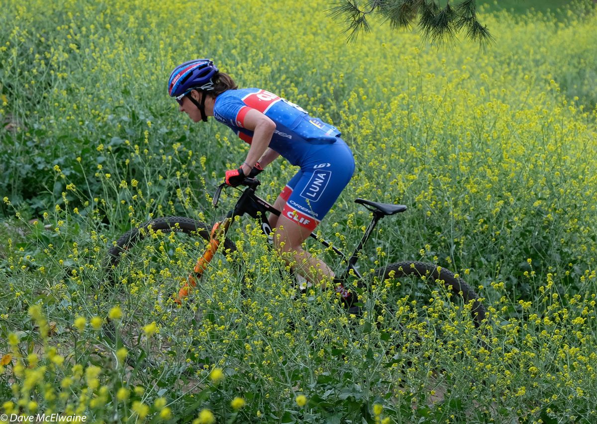 Lea Davison (Clif Pro Team) climbing out of the saddle mid-race