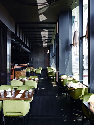 A dinning tables with pista green color chair.