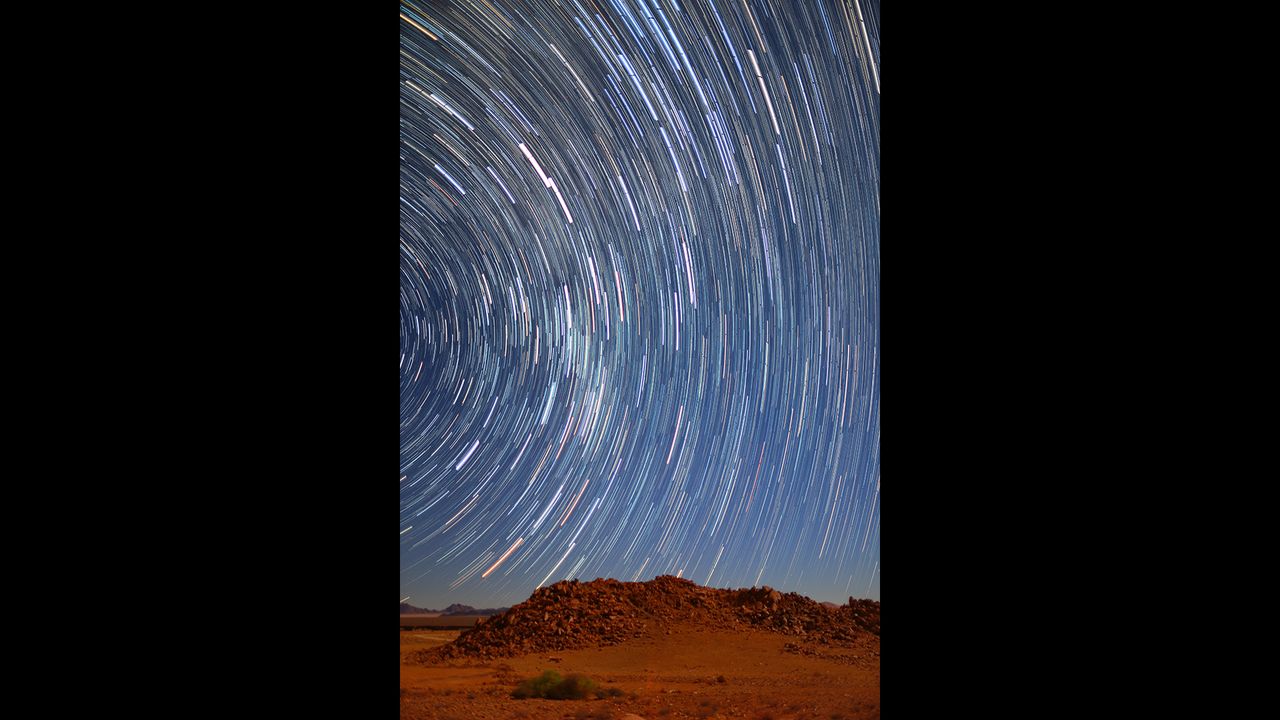 The image was taken while the photographer was staying in Sossus Dune Lodge, in the Namib Naukluft Park in Namibia. Situated in the tranquil and remote area, the lodge has the reputation of being the perfect place for stargazers. The photographer was intrigued by the warning sign in the lodge which warned guests to keep the doors shut in case baboons snuck in, so he spent the night expecting a baboon to spring into the shot!