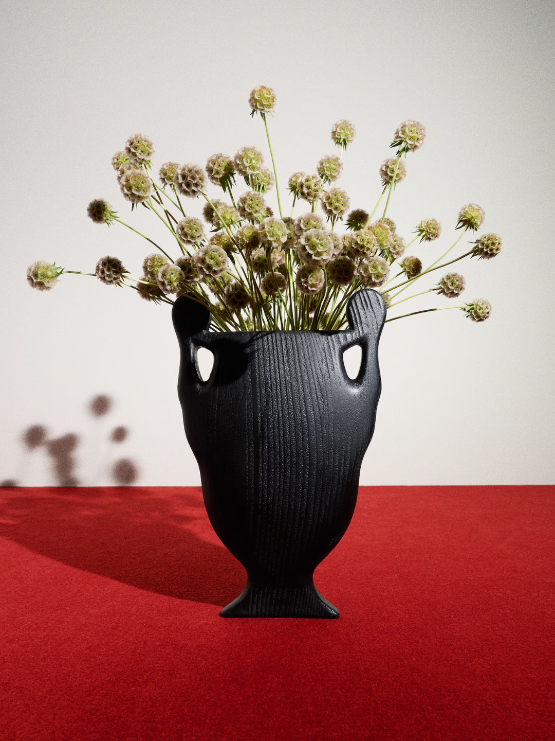 A black wood and glass vase from Kelly Wearstler x H&amp;amp;M
