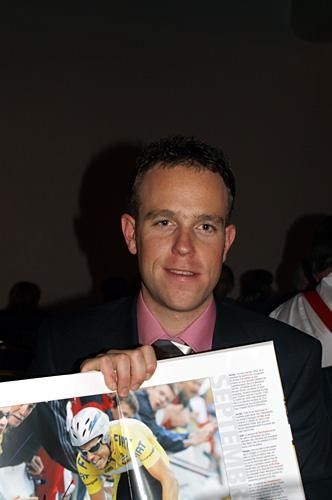 Kim Kirchen with a book on the Tour of Poland, which he won this year