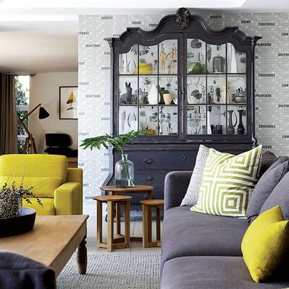 living room with cabinet and grey sofa