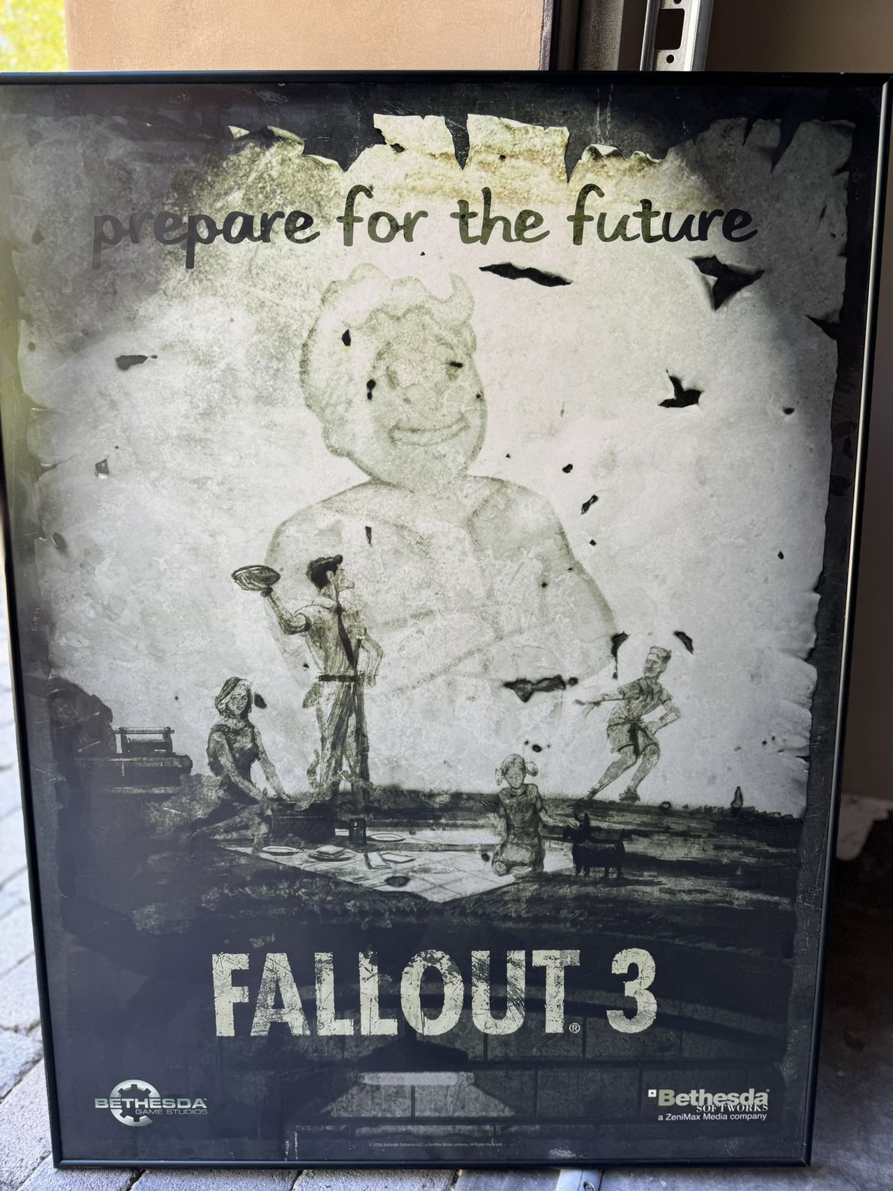 Promotional poster for Fallout 3 with Vault Boy overlooking happy '50s-style US family under text reading "prepare for the future"