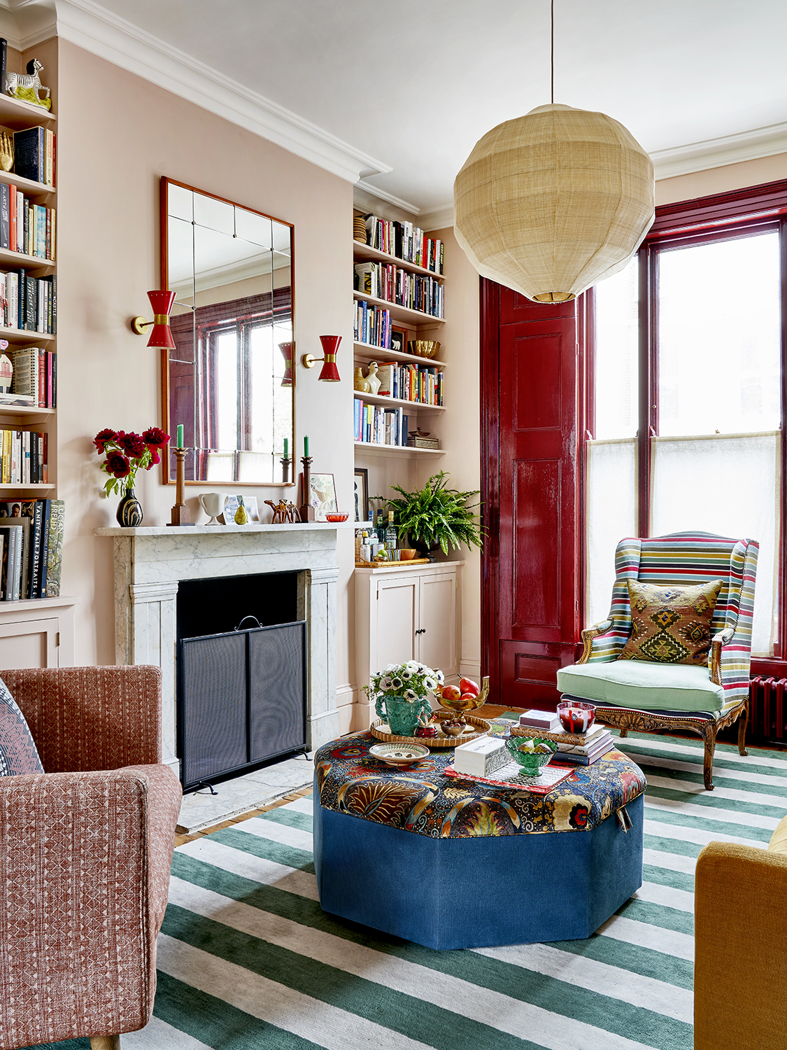 pink living room with striped green rug