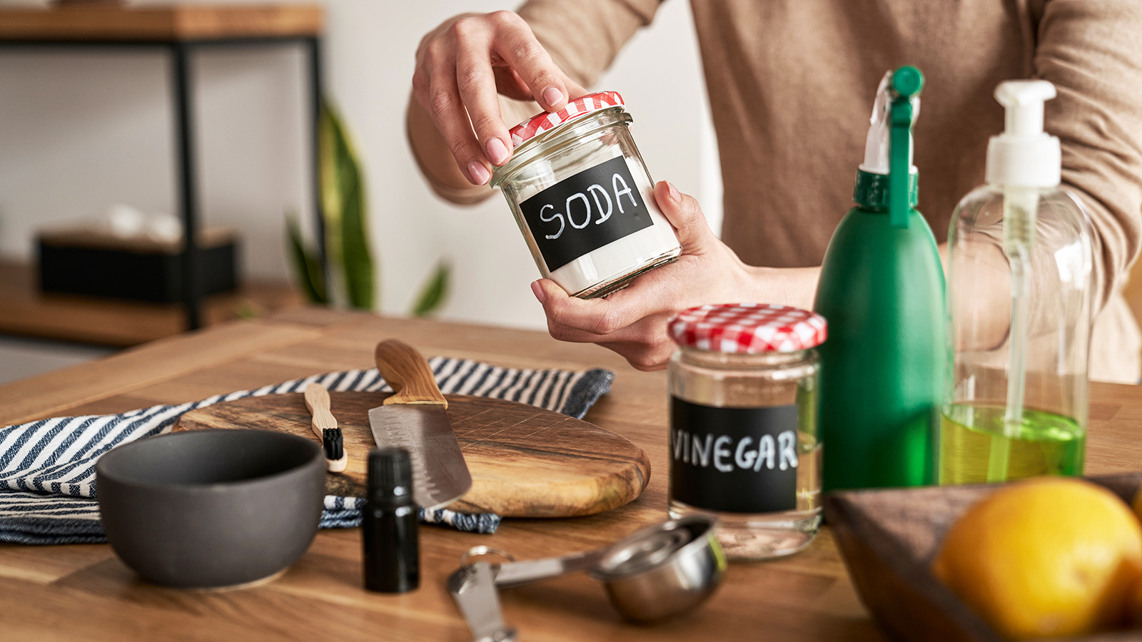 Natural cleaning supplies including baking soda and lemon