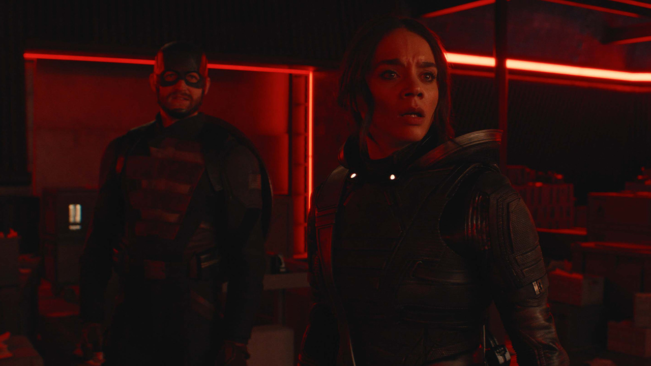 US Agent and Ghost standing in a red-lit room in Marvel's Thunderbolts movie