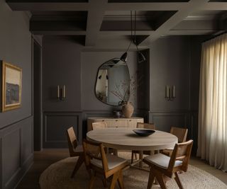 dark dining room with color drenched gray-brown walls