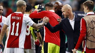 Antony Matheus Dos Santos of Ajax and Ajax head coach Erik ten Hag celebrate victory during the UEFA Champions League match between Sporting CP and Ajax Amsterdam at Estadio Jose Alvalade on September 15, 2021 in Lisbon, Portugal.