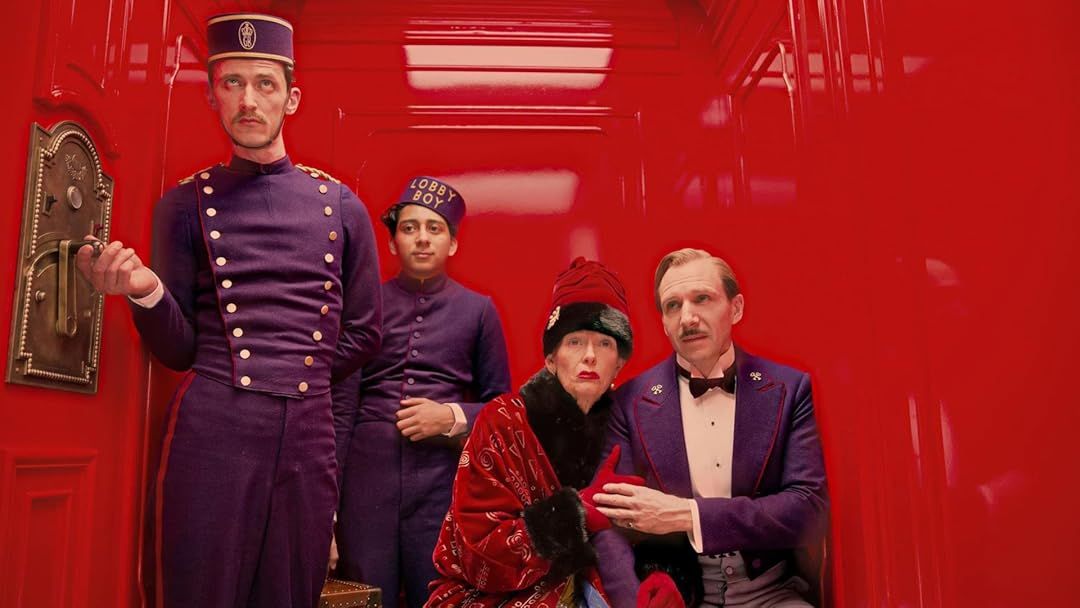 Tilda Swinton, Ralph Fiennes and Tony Revolori in an elevator in The Grand Budapest Hotel 