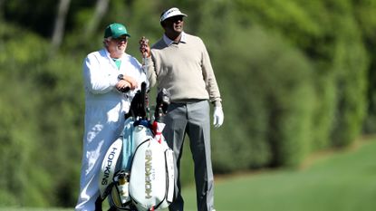 Kip Henley caddying for Vijay Singh at The Masters in 2017