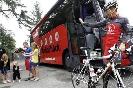 Armstrong waves goodbye to his children before heading out.