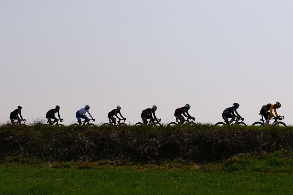 SANREMO ITALY MARCH 19 Silhouettes of riders competing in a landscape during the 113th MilanoSanremo 2022 a 293km one day race from Milano to Sanremo MilanoSanremo on March 19 2022 in Sanremo Italy Photo by Tim de WaeleGetty Images