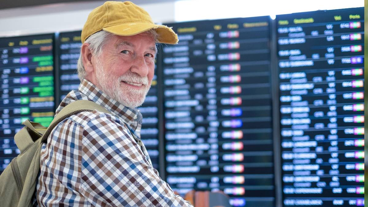 Happy older man at the airport