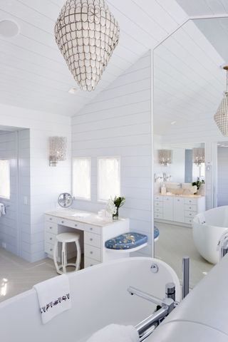 A blue drenched bathroom