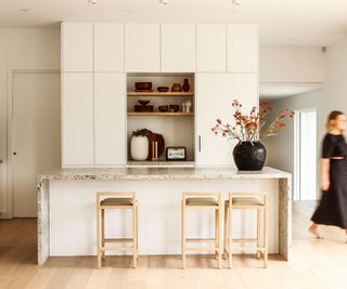 modern cream kitchen with island and full height units