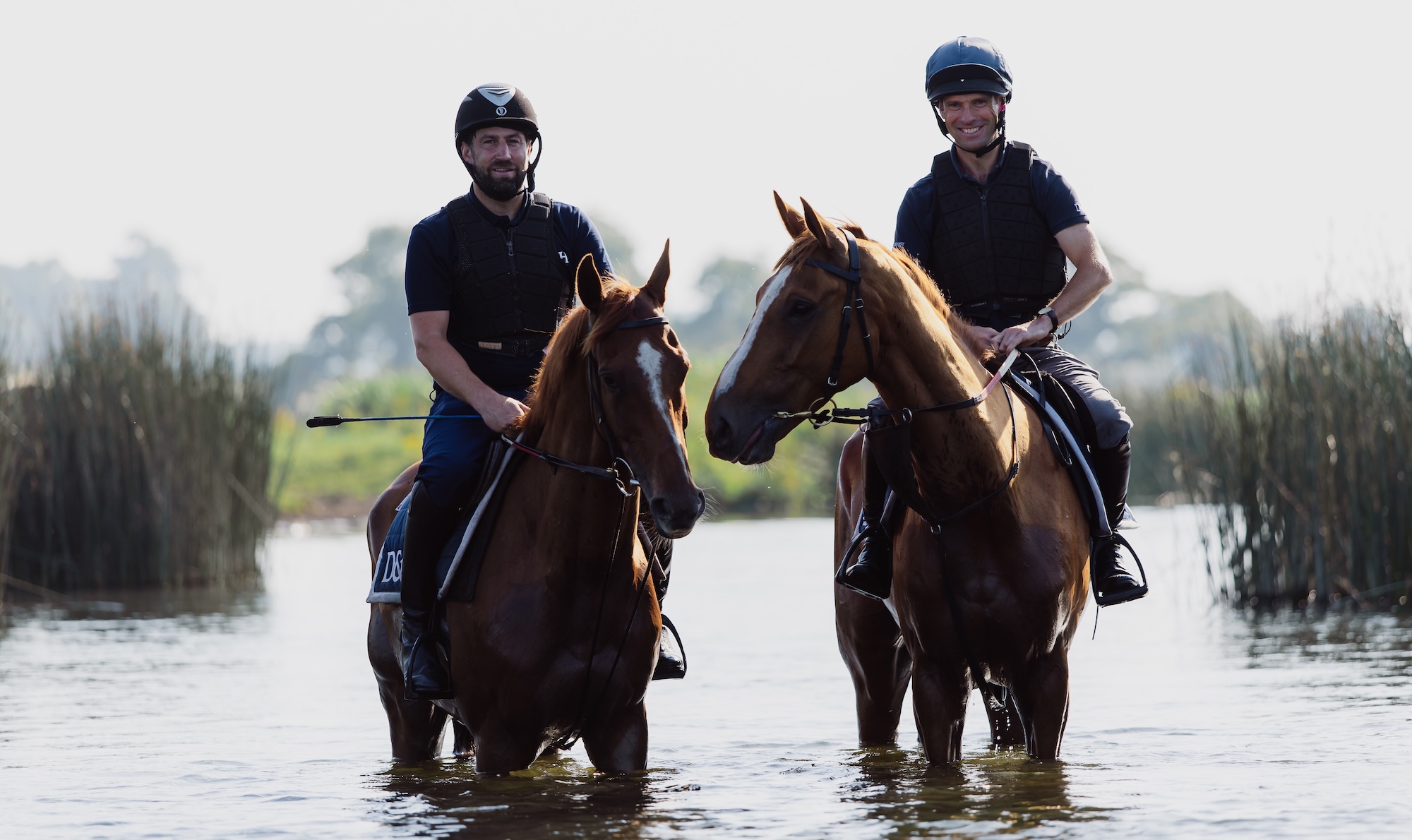 Christian Williams and Harry riding horses in the River Ewenny