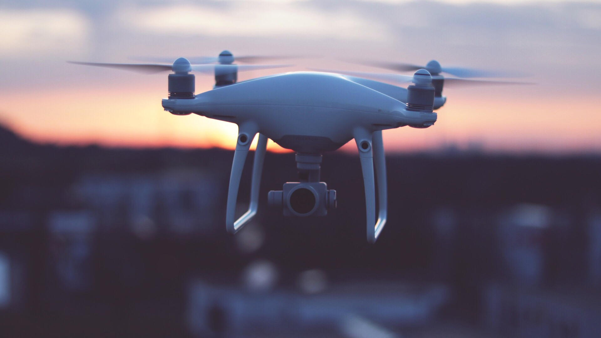 What is an FPV drone?The image shows a drone flying in the evening