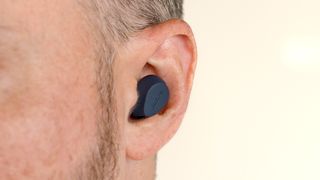 Close-up of Jabra Elite 8 Active earbud in ear.