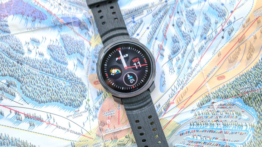 Polar Vantage M3 close up of the main watch face with the device resting on a ski mountain map