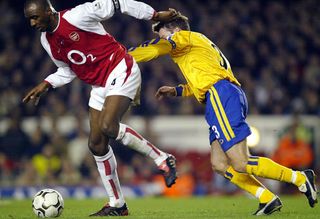 Arsenal's Patrick Vieira holds off Southampton's Graeme Le Saux in a Premier League clash in February 2004.