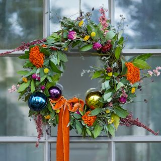 Christmas wreath decorated with foliage and baubles