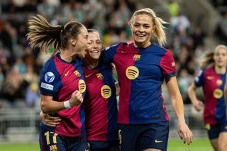 Ewa Pajor of FC Barcelona celebrates with Clàudia Pina and Fridolina Rolfo after scoring 0-1 during the UEFA Women's Champions League match between Hammarby IF and FC Barcelona at Tele2 Arena on December 12, 2024 in Stockholm, Sweden.