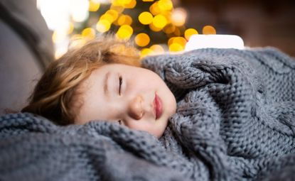 Small girl sleeping at Christmas time