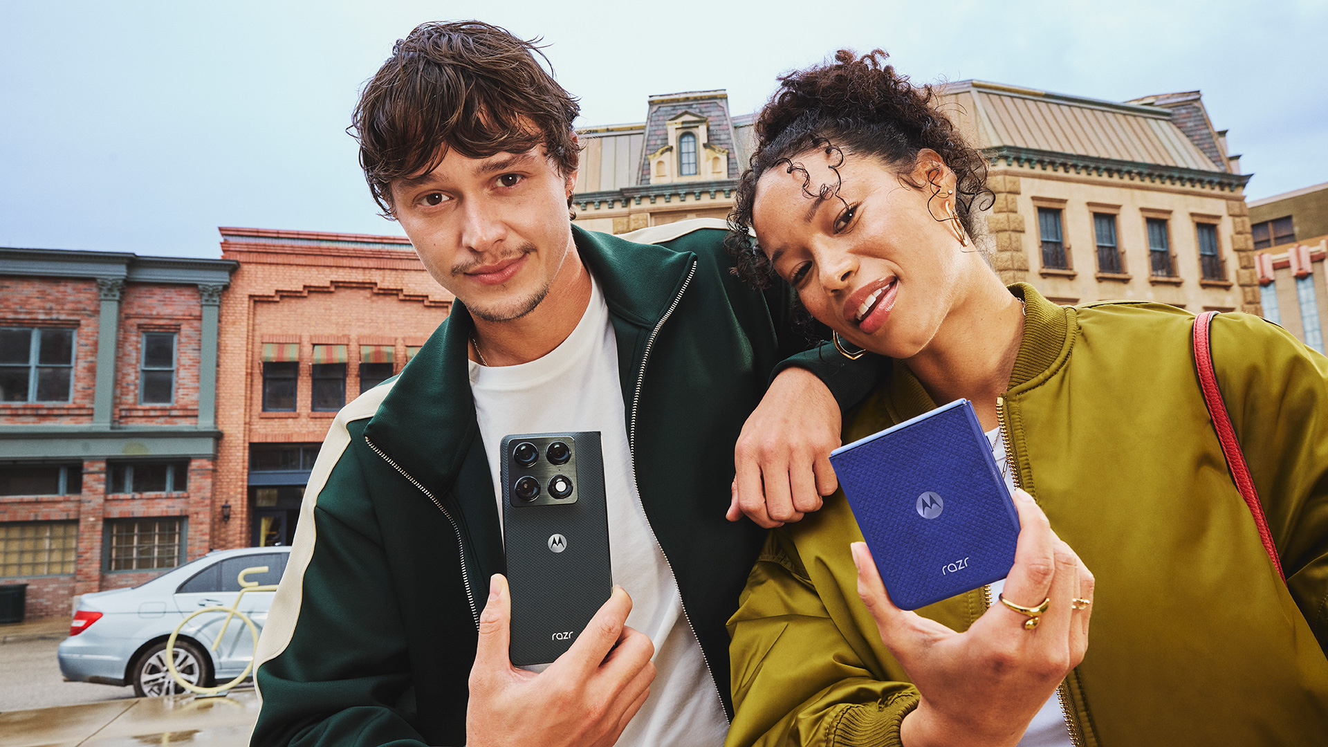 Image showing man holding Motorola Razr Fold and woman holding Motorola Razr 70 Ultra